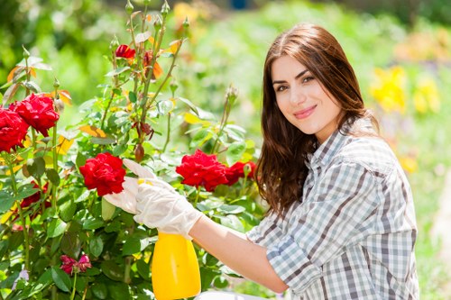 Professional gardener reviewing service scope and customer responsibilities